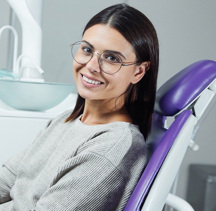 Smiling woman in periodontal office