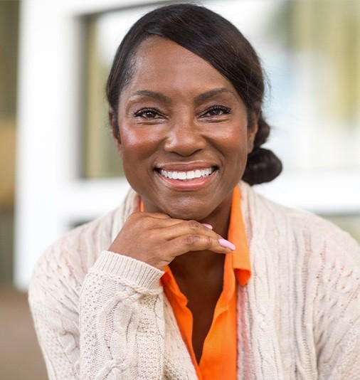 Woman sharing smile after receiving top quality periodontal treatment