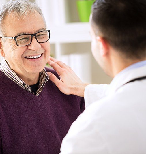 Periodontist and patient discussing treatment plan