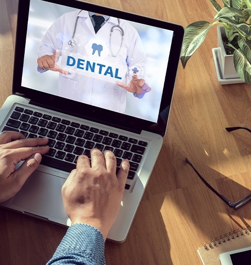 Patient reviewing dental insurance coverage on computer screen