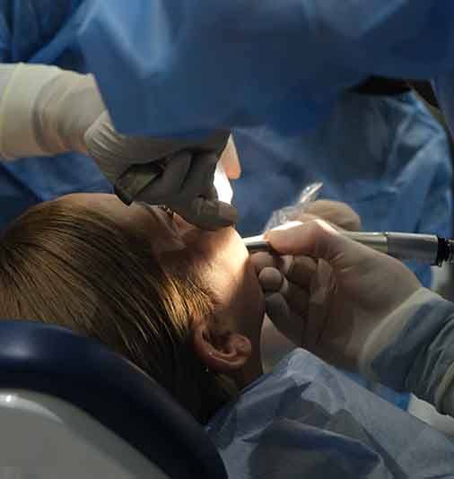 Woman getting oral surgery