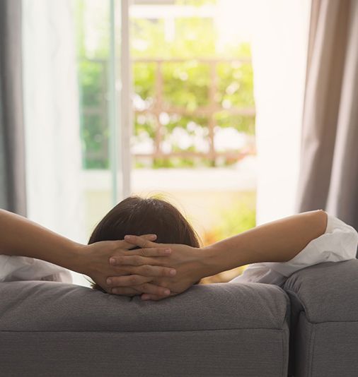 Woman resting at home after gum graft in Salt Lake City, UT