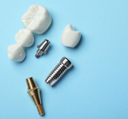 various parts of dental implants with a blue background