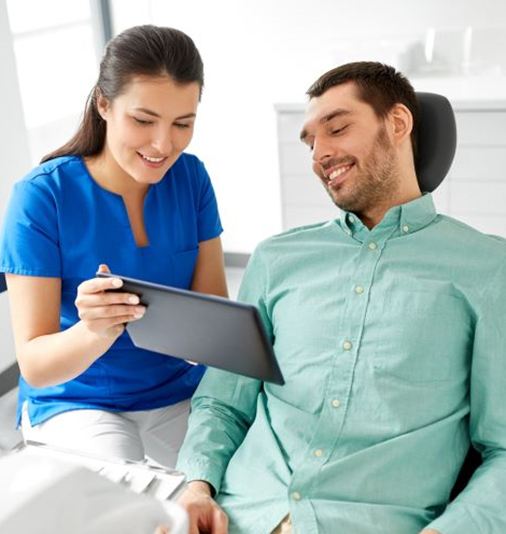 Patient engaged in conversation with dental team member