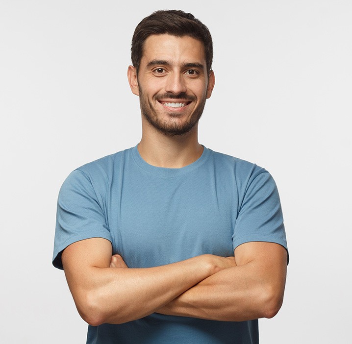 Portrait of handsome, smiling man in blue t-shirt