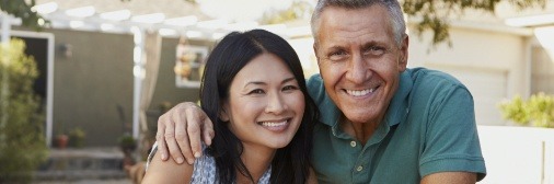Couple with healthy smiles after periodontal therapy