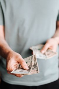 Man holding money for payment