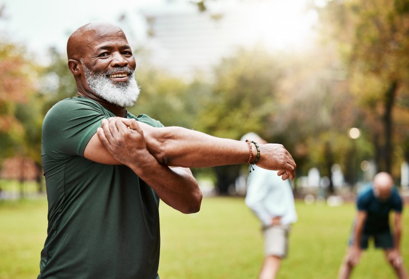 older man with dental implants 