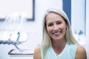 Smiling older woman in dentist’s office