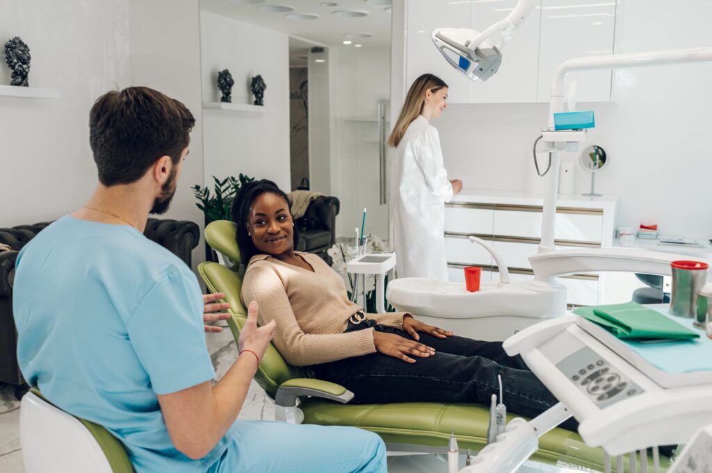 Woman in dental chair consulting with her provider